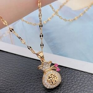 Gold Lucky Bag Pendant Necklace with Pink Accents. NWT